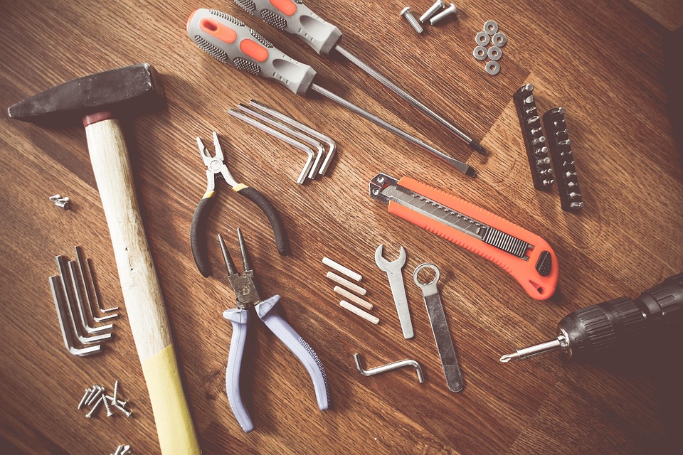 Handyman tools on wooden background